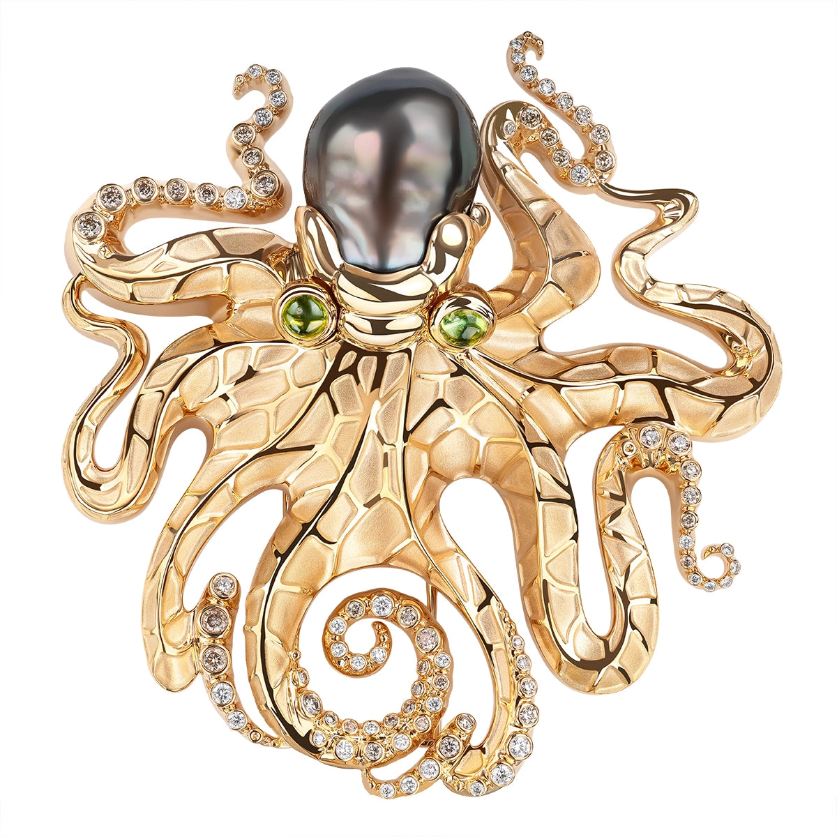 Gold octopus-shaped brooch with gemstones on a white background
