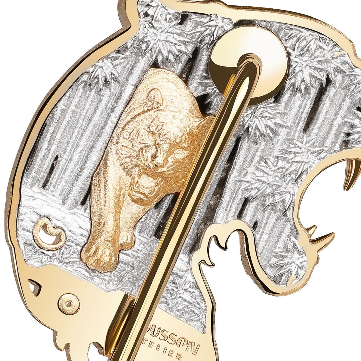 Close-up of a Mousson Atelier enamel pin featuring a roaring tiger in matt gold over a textured white gold background of bamboo forest, with a gold border and pin clasp visible.